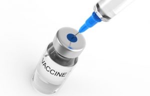 Syringe and vaccine  bottle on white background